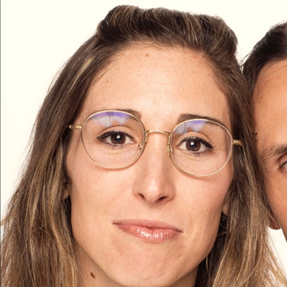 Gold prescription glasses.